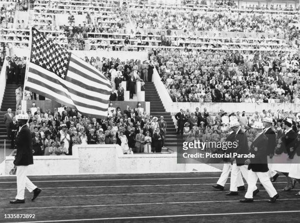 American decathlete and flagbearer Rafer Johnson leads the United States Olympic team at the opening ceremony of the 1960 Summer Olympics, in the...