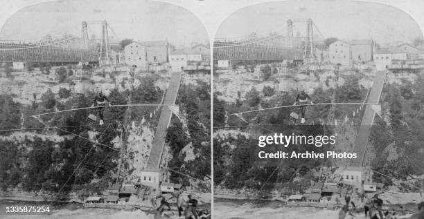 Stereoscopic image of French tightrope walker and acrobat Charles Blondin crossing the Niagara Gorge on a tightrope, on the Canada–US border, circa...