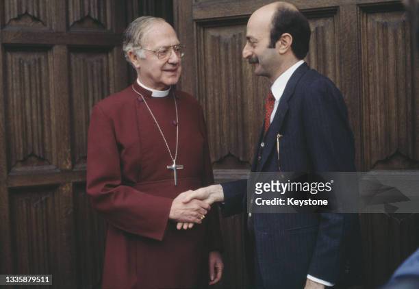 British Anglican bishop Robert Runcie , Archbishop of Canterbury, shakes hands with Lebanese Druze politician Walid Jumblatt at Lambeth Palace, the...
