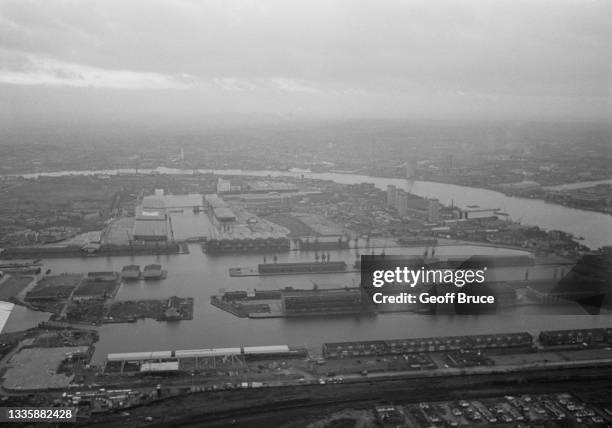 High angle view of West India Docks, a series of three docks, on the Isle of Dogs, looking south, in London, England, 5th January 1981. Designed by...