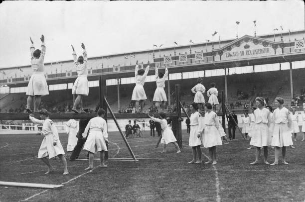 Unspecified Danish gymnasts on the balance beam at the 1908 Summer Olympics at White City Stadium in London, England, July 1908. The 1908 Games saw...