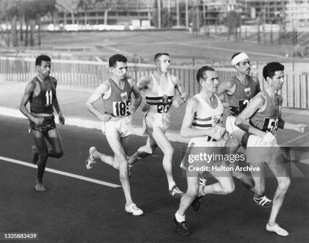 Ethiopian athlete Abebe Bikila , Moroccan athlete Allal Saoudi, Belgian athlete Aurele Vandendriessche, Moroccan athlete Rhadi Ben Abdesselam ,...