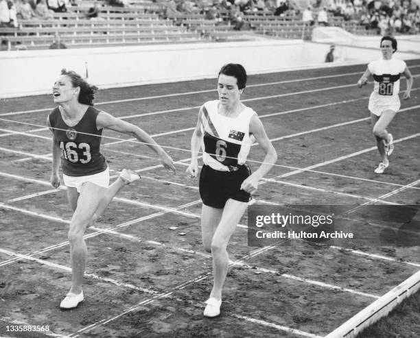 Russian-born Soviet athlete Lyudmila Shevtsova finishes ahead of Australian athlete Brenda Jones in the final of the women's 800-metres event at the...