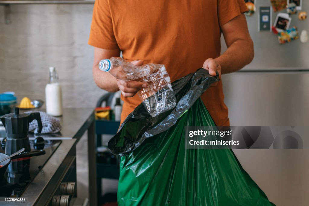 Cooking At Home: Handsome Man With Garbage Bag
