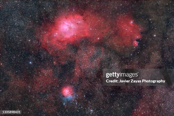 lagoon and trifid nebulae (messier 8 and messier 20) - the archer stock pictures, royalty-free photos & images