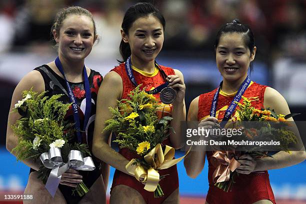 Rosannagh MacLennan of Canada , Wenna He of China and Dan Li of China pose after the Individual Trampoline Womens Final during the 28th Trampoline...