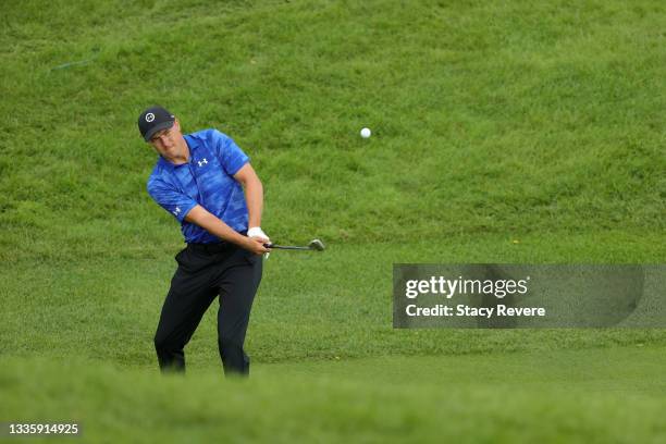 Jordan Spieth of the United States chips to the first green during the final round of THE NORTHERN TRUST, the first event of the FedExCup Playoffs,...