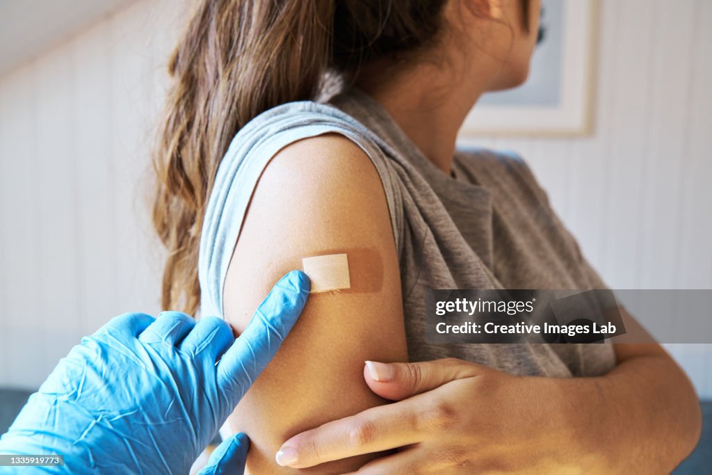 Woman getting vaccinated against Covid-19.