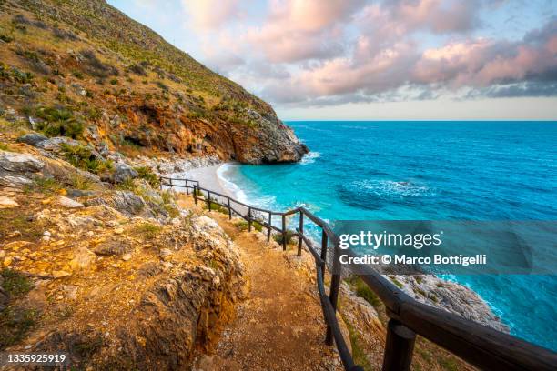 foopath to idyllic beach - coastal footpath stock pictures, royalty-free photos & images