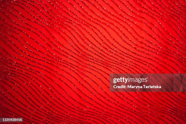 universal fabric background with red glitters. - royal background stock pictures, royalty-free photos & images