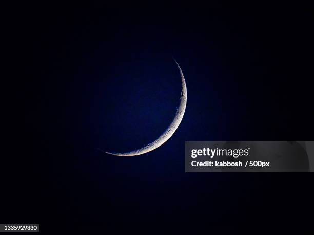 low angle view of moon against sky at night - crescent stock pictures, royalty-free photos & images