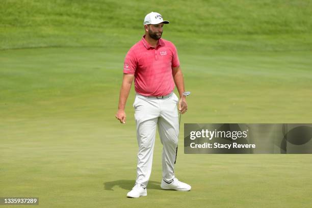 Jon Rahm of Spain reacts to his putt on the first green during the final round of THE NORTHERN TRUST, the first event of the FedExCup Playoffs, at...