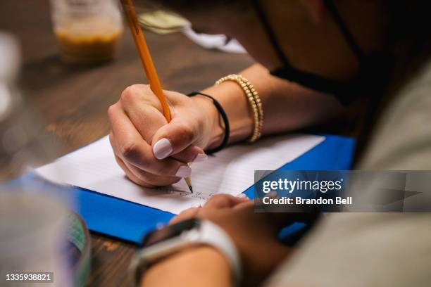 Student takes notes during instruction at the Xavier Academy on August 23, 2021 in Houston, Texas. In-person classroom sessions are resuming and...