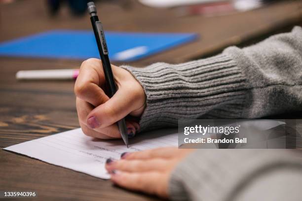 Student takes notes during instruction at the Xavier Academy on August 23, 2021 in Houston, Texas. In-person classroom sessions are resuming and...