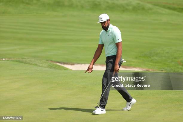 Tony Finau of the United States reacts to his putt on the first green during the final round of THE NORTHERN TRUST, the first event of the FedExCup...