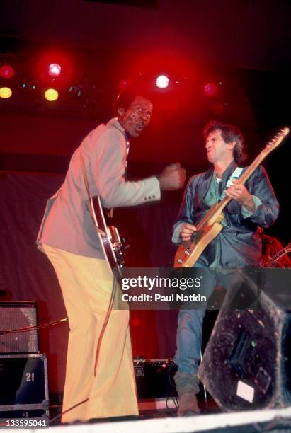 British musician Keith Richards performs with American musician Chuck Berry during the Chicago Blues Festival at the Petrillo Bandshell, Chicago,...