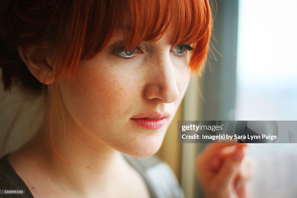 Woman gazing out window