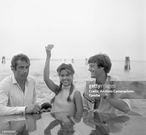 American actress Jane Fonda with her brother Peter Fonda and her husband Roger Vadim portrayed on a water taxi crossing the Canal Grande, Venice,...