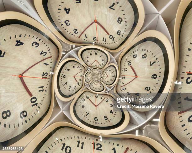 wooden clock time spiral - distorted image stock pictures, royalty-free photos & images