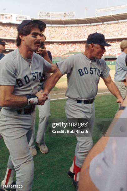 Boston Red Sox Bill Buckner celebrates as he leaves the field after Game 5 during ALCS, October 12, 1986 in Anaheim, California.