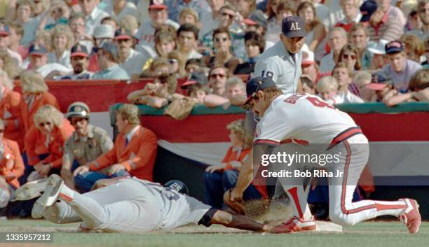 California Angels Bobby Grich has a close tag at 1st base with Boston Red Sox Don Baylor during pick-off attempt during ALCS, October 12, 1986 in...