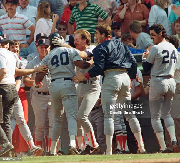 Boston Red Sox Dave Henderson is mobbed by Wade Boggs , Rich Geldman , Dwight Evans and teammates after home run victory in Game 5 during ALCS,...