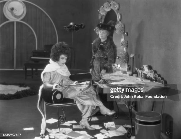 Russian-American actress Alla Nazimova , as Marguerite Gautier, and Zeffie Tilbury as Prudence, in a scene from 'Camille', directed by Ray C...