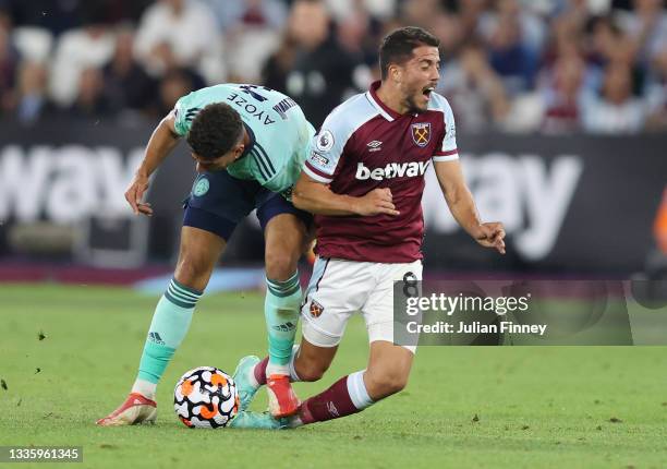 Ayoze Perez of Leicester City is show a red card and sent off for this challenge on Pablo Fornals of West Ham United during the Premier League match...