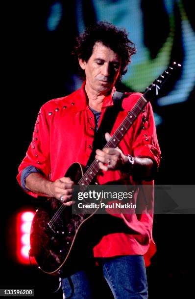 British musician Keith Richards of the Rolling Stones performs on stage during the band's 'Voodoo Lounge' tour, late 1994.