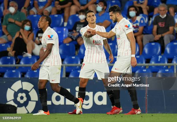 Erik Lamela of Sevilla celebrates with Rafa Mir after scoring their team's first goal during the LaLiga Santander match between Getafe CF and Sevilla...