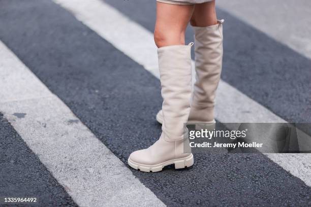 Christina Biluca wearing beige Copenhagen knee-high boots on August 03, 2021 in Munich, Germany.