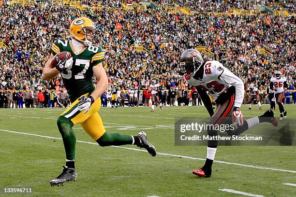 Jordy Nelson of the Green Bay Packers races for the endzone after making a reception against Myron Lewis of the Tampa Bay Buccaneers at Lambeau Field...