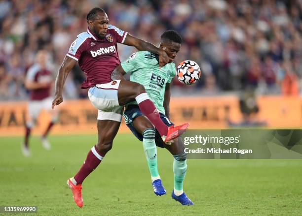 Michail Antonio of West Ham United and Daniel Amartey of Leicester City battle for the ball during the Premier League match between West Ham United...