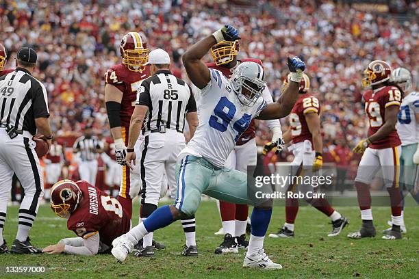 DeMarcus Ware of the Dallas Cowboys celebrates after sacking Rex Grossman of the Washington Redskins during the second half at FedExField on November...