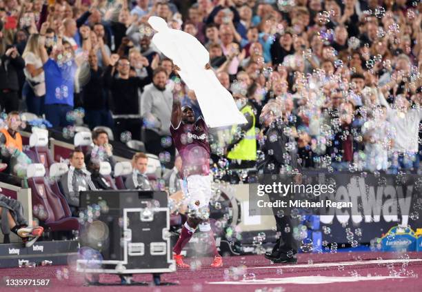 Michail Antonio of West Ham United celebrates after scoring their team's third goal during the Premier League match between West Ham United and...