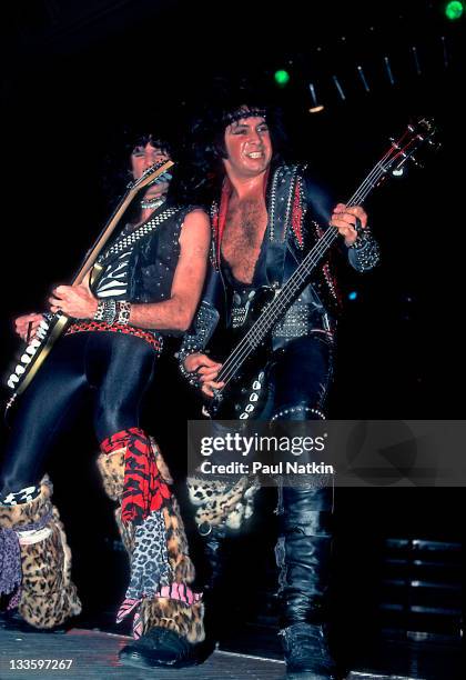 American musicians Bruce Kulick and Gene Simmons of the group Kiss perform at the Mecca Arena, Milwaukee, Wisconsin, December 30, 1984.
