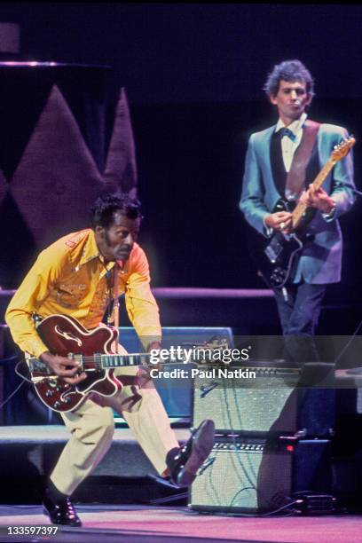 American musician Chuck Berry and British musician Keith Richards on stage at the Fox Theater for a performance filmed as the 'Hail! Hail! Rock and...