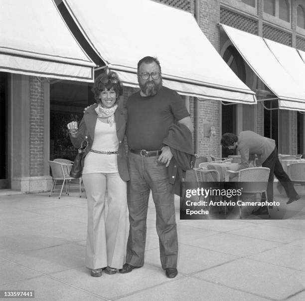 Italian director Sergio Leone outside the Excelsior Hotel with his wife Carla, Lido, Venice, 1972.