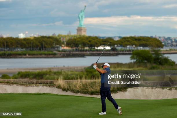 Alex Noren of Sweden plays an approach shot on the 18th hole during the final round of THE NORTHERN TRUST, the first event of the FedExCup Playoffs,...