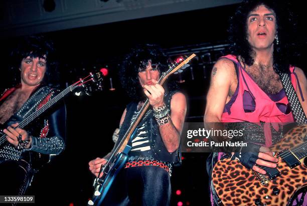 From left, American musicians Gene Simmons, Bruce Kulick, and Paul Stanley of the group Kiss perform at the Mecca Arena, Milwaukee, Wisconsin,...