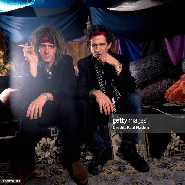 British musician Keith Richards backstage American musician Izzy Stradlin on the former's 'Main Offender' tour, early 1993.