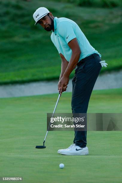 Tony Finau of the United States putts on the first-playoff 18th hole during the final round of THE NORTHERN TRUST, the first event of the FedExCup...