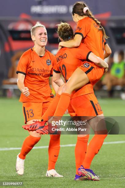 Shea Groom celebrates with Veronica Latsko and Sophie Schmidt of Houston Dash after scoring her second goal to add to the 2-0 lead during the Women's...