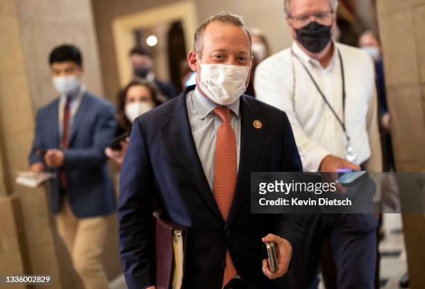 Rep. Josh Gottheimer walks to the office of House Speaker Nancy Pelosi at the Capitol on August 23, 2021 in Washington, DC. Gottheimer and a group of...
