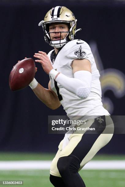 Taysom Hill of the New Orleans Saints looks to throw a pass against the Jacksonville Jaguars at Caesars Superdome on August 23, 2021 in New Orleans,...