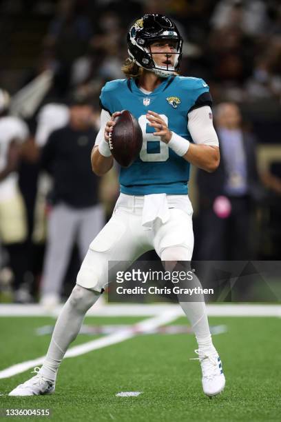 Trevor Lawrence of the Jacksonville Jaguars looks to throw a pass against the New Orleans Saints at Caesars Superdome on August 23, 2021 in New...
