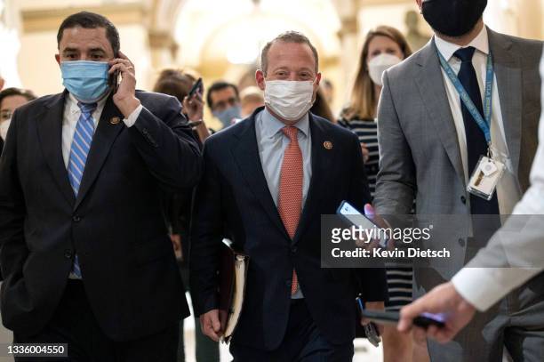 Rep. Josh Gottheimer and Rep. Henry Cuellar walk to the office of House Speaker Nancy Pelosi at the Capitol on August 23, 2021 in Washington, DC....