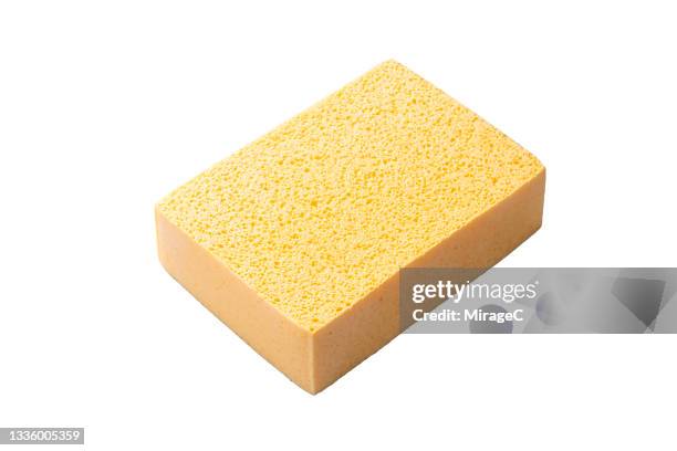 yellow cleaning sponge on isolated on white - cleaning sponge stock pictures, royalty-free photos & images