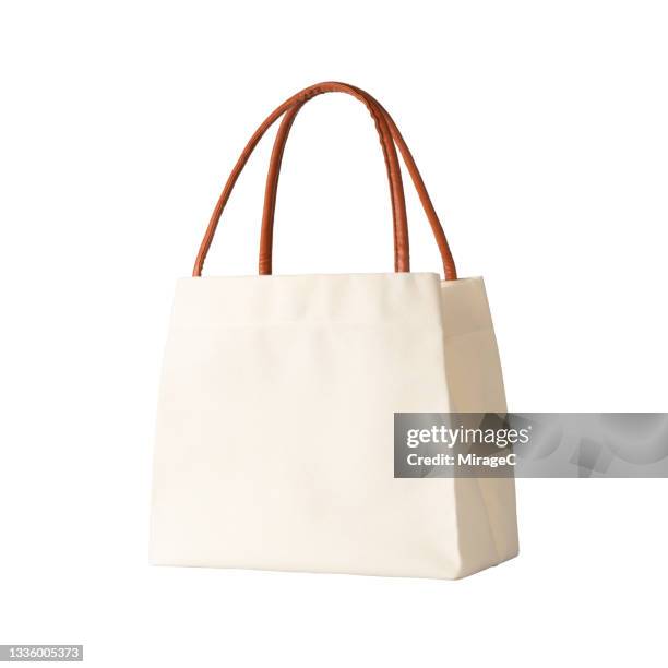 eco-friendly reusable shopping bag on white - tote bags photos et images de collection