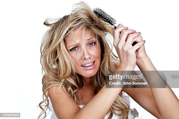 woman having a bad hair day - frizzy 個照片及圖片檔